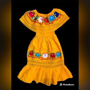 The yellow dress is size 2T but runs large and has an embroidered floral design